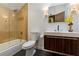 Modern bathroom with glass shower, updated vanity, and neutral tile at 256 New Gate Loop, Lake Mary, FL 32746