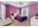 Charming bedroom with patterned walls, window with shutters and cozy sitting area at 256 New Gate Loop, Lake Mary, FL 32746