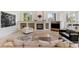 Spacious living room features a fireplace, built-in shelving, and ample natural light at 256 New Gate Loop, Lake Mary, FL 32746