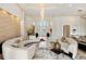 Spacious living room with curved sectional sofa and large windows at 256 New Gate Loop, Lake Mary, FL 32746