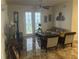Living room with tiled floors and French doors at 3000 Laurel Park Ln # 104, Kissimmee, FL 34741