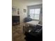 Spacious bedroom with a comfy bed, a home office area, and a large window at 3000 Laurel Park Ln # 104, Kissimmee, FL 34741
