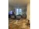 Living room with tiled floor and access to patio at 3000 Laurel Park Ln # 104, Kissimmee, FL 34741