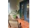 Relaxing screened balcony with patio furniture and potted plants at 3000 Laurel Park Ln # 104, Kissimmee, FL 34741