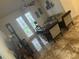 Living room with tiled floors and French doors at 3000 Laurel Park Ln # 104, Kissimmee, FL 34741