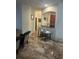 Kitchen with breakfast bar and view into living area at 3000 Laurel Park Ln # 104, Kissimmee, FL 34741