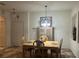 Bright dining room features a wood table with four chairs and a built-in hutch at 3000 Laurel Park Ln # 104, Kissimmee, FL 34741