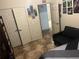 Bedroom with double doors and tiled floor at 3000 Laurel Park Ln # 104, Kissimmee, FL 34741