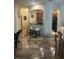 Kitchen features dark wood cabinets, a breakfast bar, and black appliances at 3000 Laurel Park Ln # 104, Kissimmee, FL 34741