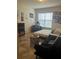 Bright bedroom featuring a comfortable bed and a dedicated workspace at 3000 Laurel Park Ln # 104, Kissimmee, FL 34741