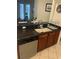 Modern kitchen with granite countertop and built-in dishwasher at 3000 Laurel Park Ln # 104, Kissimmee, FL 34741
