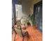 Relaxing screened balcony with patio furniture and potted plants at 3000 Laurel Park Ln # 104, Kissimmee, FL 34741