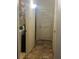 Hallway with laundry area and tiled floor at 3000 Laurel Park Ln # 104, Kissimmee, FL 34741