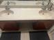 Double vanity bathroom sinks with wood cabinets at 3000 Laurel Park Ln # 104, Kissimmee, FL 34741