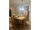 Bright dining room features a wood table with four chairs and a built-in hutch at 3000 Laurel Park Ln # 104, Kissimmee, FL 34741