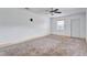 Bedroom with carpet, ceiling fan, and window at 1343 Poppy Ave, Orlando, FL 32811