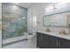 Elegant bathroom with a walk-in shower and double vanity at 2228 Sylvan Ct, Kissimmee, FL 34746
