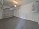 Spacious garage with painted floor and overhead lighting at 7924 Spectrum Dr, Kissimmee, FL 34747