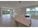 Spacious living room with tile floors and sliding glass doors leading to a patio at 7924 Spectrum Dr, Kissimmee, FL 34747