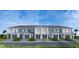 New townhome community with attached garages and curb appeal at 7924 Spectrum Dr, Kissimmee, FL 34747