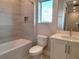 Modern bathroom with a shower/tub combo and vanity at 7924 Spectrum Dr, Kissimmee, FL 34747