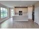 Open concept kitchen with white cabinets and stainless steel appliances at 7924 Spectrum Dr, Kissimmee, FL 34747