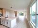 Modern kitchen with white cabinets, quartz countertops, and stainless steel appliances at 7924 Spectrum Dr, Kissimmee, FL 34747