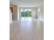 Bright and airy living room with sliding glass doors and tile flooring at 7924 Spectrum Dr, Kissimmee, FL 34747