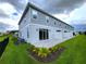 Townhome rear elevation with patio and fenced backyard at 7924 Spectrum Dr, Kissimmee, FL 34747