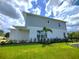 Home's exterior showcasing landscaping and a modern design at 7924 Spectrum Dr, Kissimmee, FL 34747