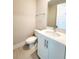 Clean bathroom with white vanity, quartz countertop, and modern fixtures at 7924 Spectrum Dr, Kissimmee, FL 34747