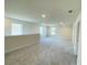 Bright and airy loft area with neutral carpeting and multiple windows at 4469 Sagefield Dr, Saint Cloud, FL 34773