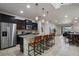 Modern kitchen with dark cabinetry and island at 8869 Rhodes St, Kissimmee, FL 34747