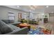 Playroom with game tables, seating and a view into another room at 8869 Rhodes St, Kissimmee, FL 34747