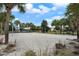 Beach volleyball court nestled amongst palm trees at 8869 Rhodes St, Kissimmee, FL 34747