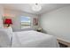 Bedroom with a plush queen bed and window overlooking a lake at 8869 Rhodes St, Kissimmee, FL 34747