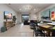 Open living space with stylish seating, large TV, and view of patio at 8869 Rhodes St, Kissimmee, FL 34747