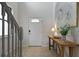 Entryway with a wooden console table and stairs at 8869 Rhodes St, Kissimmee, FL 34747