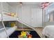 ' bedroom with bunk beds, slide, and Pokemon-themed rug and decor at 8869 Rhodes St, Kissimmee, FL 34747
