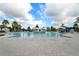 Large community pool with a pergola and lounge chairs at 8869 Rhodes St, Kissimmee, FL 34747