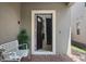 Front entry with open door to interior stairs at 8869 Rhodes St, Kissimmee, FL 34747