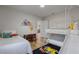 ' bedroom with bunk beds, playful Pokemon wall art, and a small table and chairs at 8869 Rhodes St, Kissimmee, FL 34747