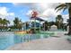 Community pool with water features and a playground at 8869 Rhodes St, Kissimmee, FL 34747