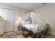 Princess-themed bedroom with a carriage bed, soft colors, and whimsical decor at 8869 Rhodes St, Kissimmee, FL 34747