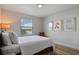 Serene bedroom with lake view, featuring a large bed and minimalist decor at 8869 Rhodes St, Kissimmee, FL 34747