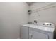Laundry room with washer, dryer and overhead shelving at 8869 Rhodes St, Kissimmee, FL 34747