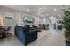 Living area featuring comfortable seating, large artwork, and open floor plan at 8869 Rhodes St, Kissimmee, FL 34747
