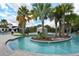 Relaxing lazy river winding through lush landscaping at 8869 Rhodes St, Kissimmee, FL 34747