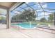 Relaxing screened-in pool and spa area with safety fence at 2807 Strand Loop Ct, Oviedo, FL 32765