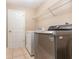 Laundry room with washer, dryer, and overhead shelving at 2807 Strand Loop Ct, Oviedo, FL 32765